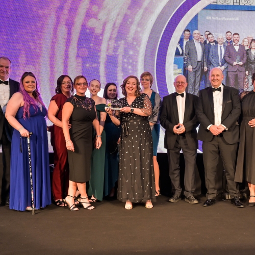 VolkerRail employees collecting an award for being the best contractor to work for in rail in 2023