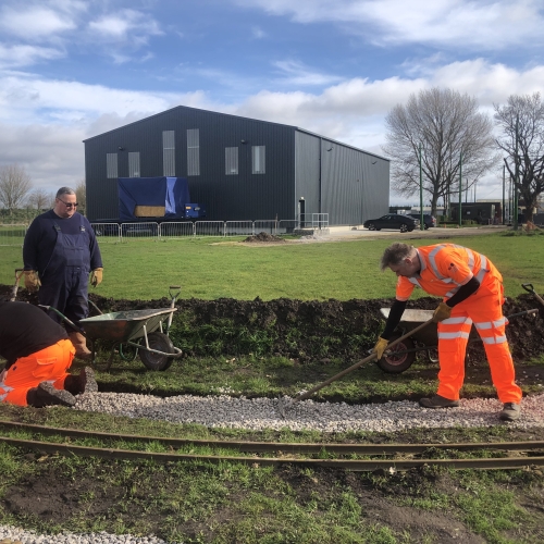 VolkerRail volunteers installing a narrow gauge railway