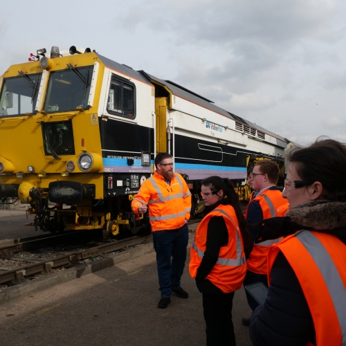 A group of students visiting a plant depot