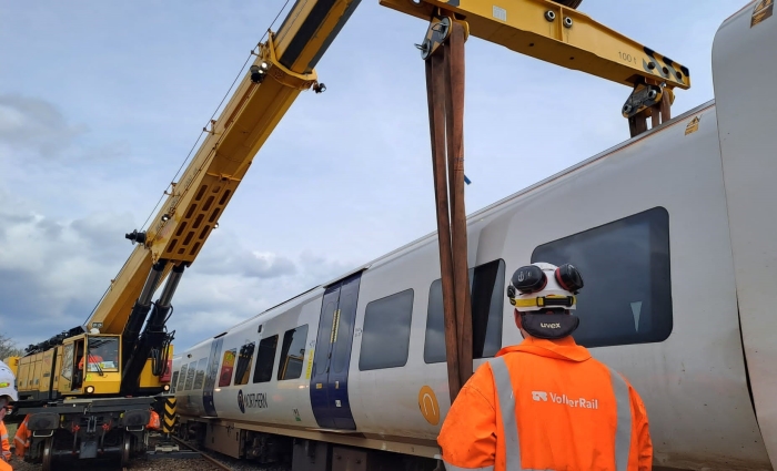 A 1200 Kirow crane rerailing a derailed passenger train