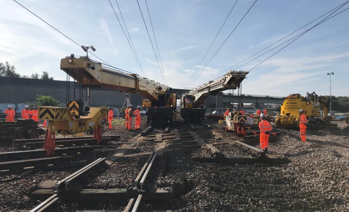 Two Kirow 1200 cranes working on the railway