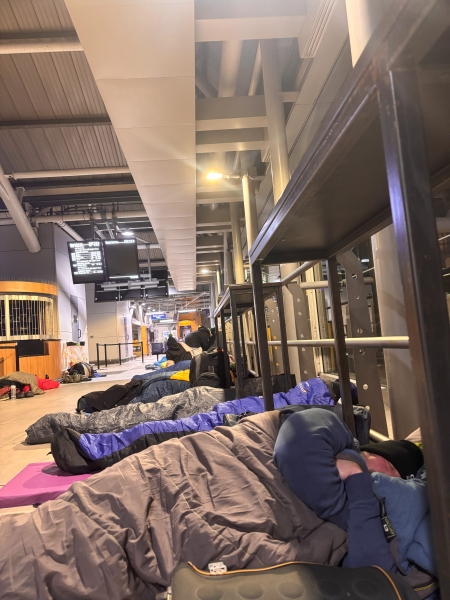 people sleeping on the floor of a railway station