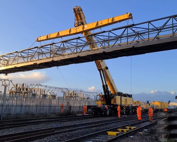 Kirow 1200 crane installing overhead line structure