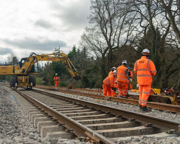 People in orange high vis working on the railway