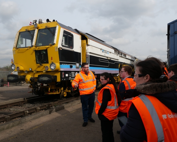A group of students visiting a plant depot