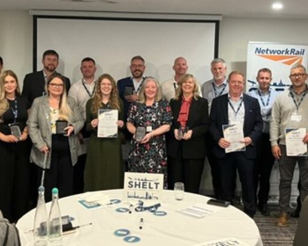 group of people with wards and certificates